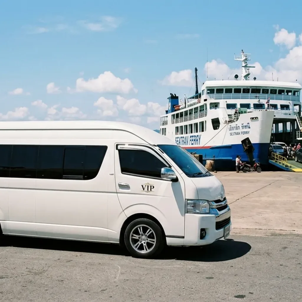 White Toyota Commuter van waiting to board Seatran Ferry at Donsak Pier to Koh Samui
