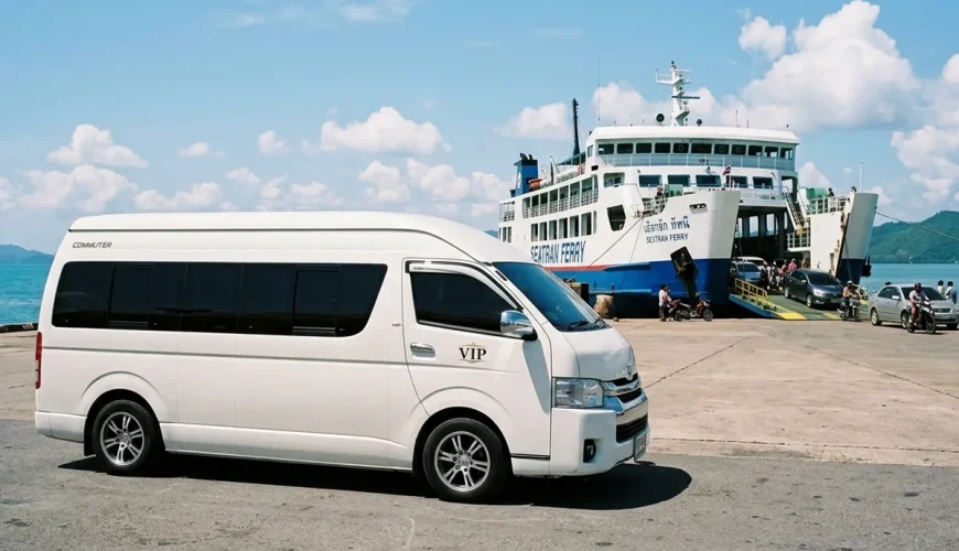 White Toyota Commuter van waiting to board Seatran Ferry at Donsak Pier to Koh Samui